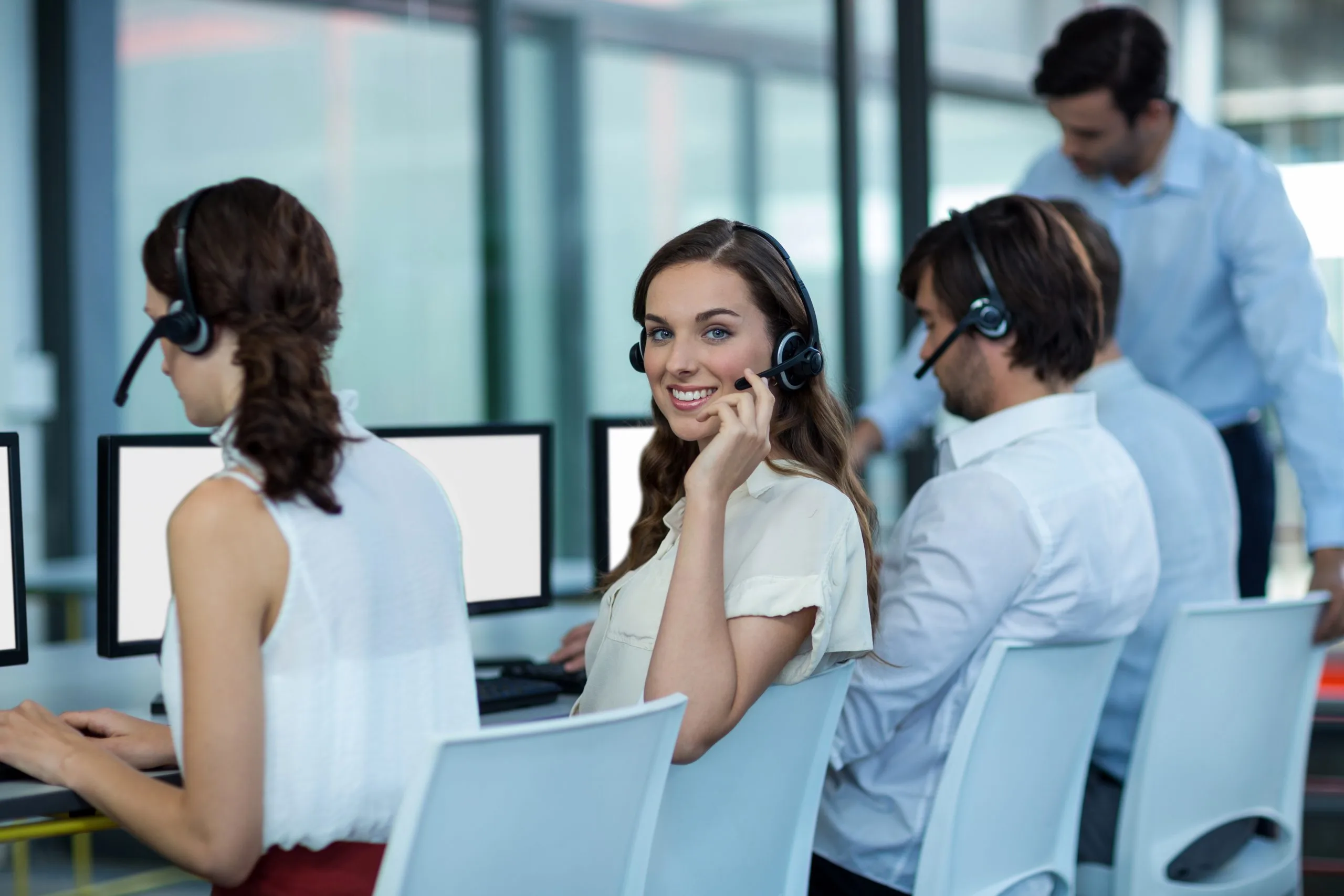 business-executives-with-headsets-using-computer-scaled-1
